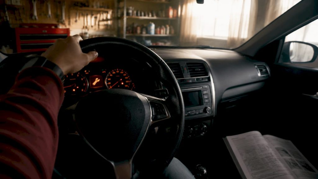 Illuminated car dashboard service maintenance light