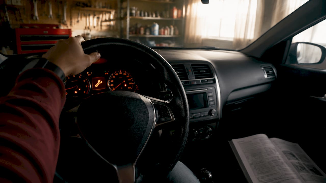 Illuminated car dashboard service maintenance light