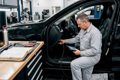 Technician performing vehicle software update diagnostics