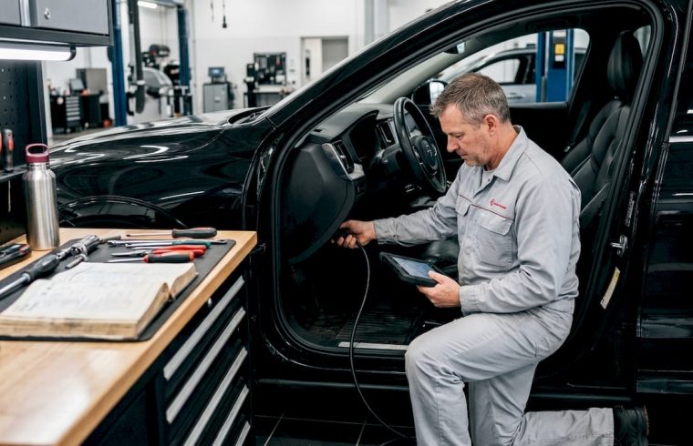 Technician performing vehicle software update diagnostics