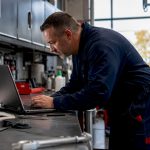 Technician checking ASE certification online