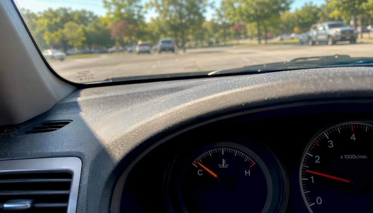 Car dashboard temperature gauge showing thermostat issue