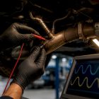 Technician testing oxygen sensor waveforms
