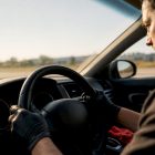 Mechanic checking steering wheel vibration