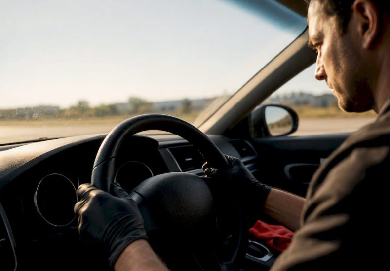 Mechanic checking steering wheel vibration