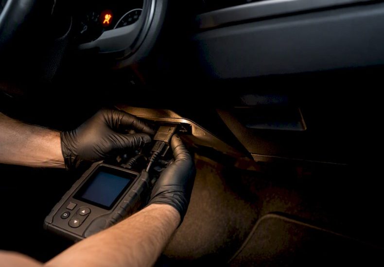 Technician connecting an SRS scan tool