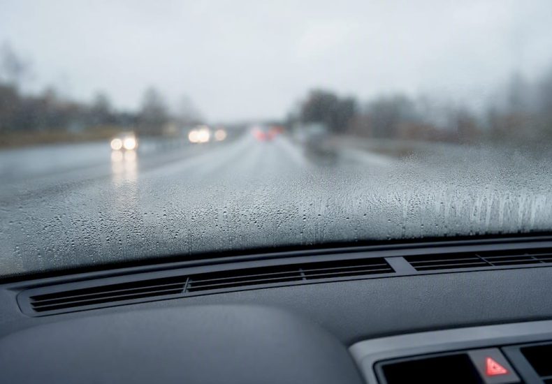 Fogged windshield viewed from inside car