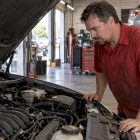 Technician observing an engine at idle